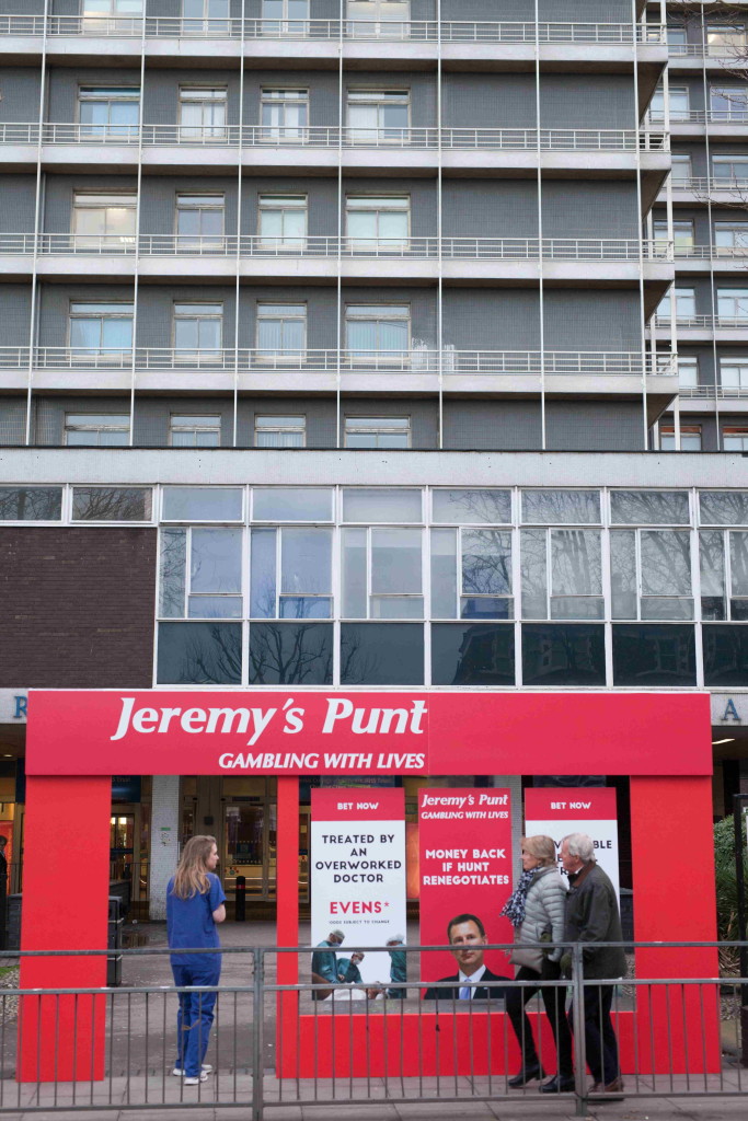 NHS junior doctors erect a faux betting shop storefront,